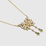 Gold necklace with a colorful butterfly pendant on a white background