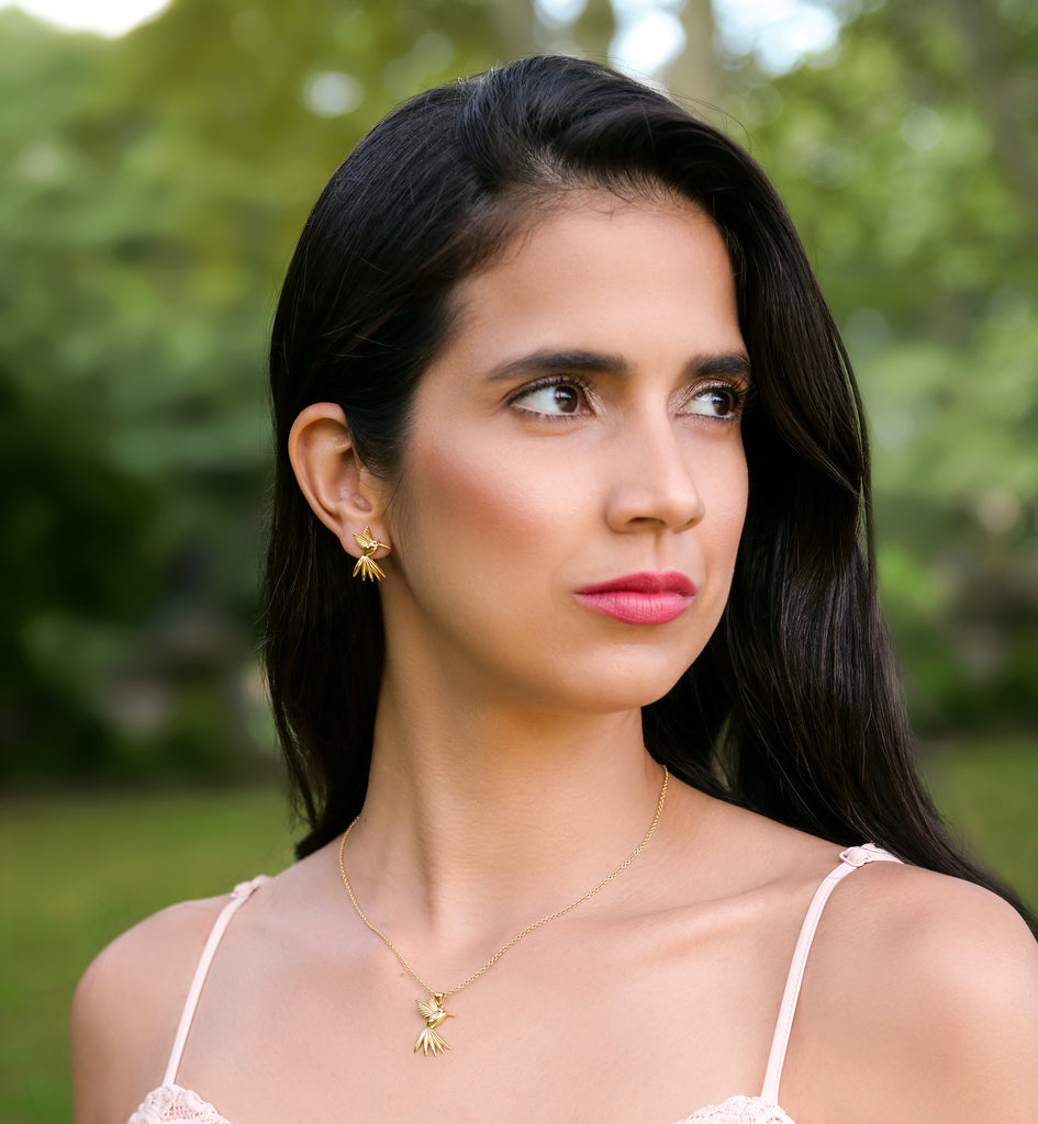 Aurora Laffite Jewelry’s Humming Beauty collection featuring solid gold hummingbird jewelry modeled to celebrate the elegance, lightness, and beauty of nature.