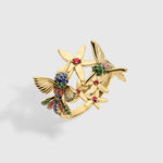 Rainbow Hummingbird ring in solid yellow gold featuring multicolored sapphires and rubies from the Humming Beauty collection by Aurora Laffite Jewelry.
