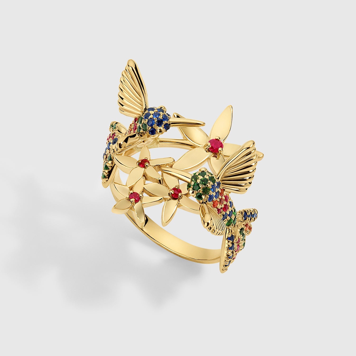 Rainbow Hummingbird ring in solid yellow gold featuring multicolored sapphires and rubies from the Humming Beauty collection by Aurora Laffite Jewelry.